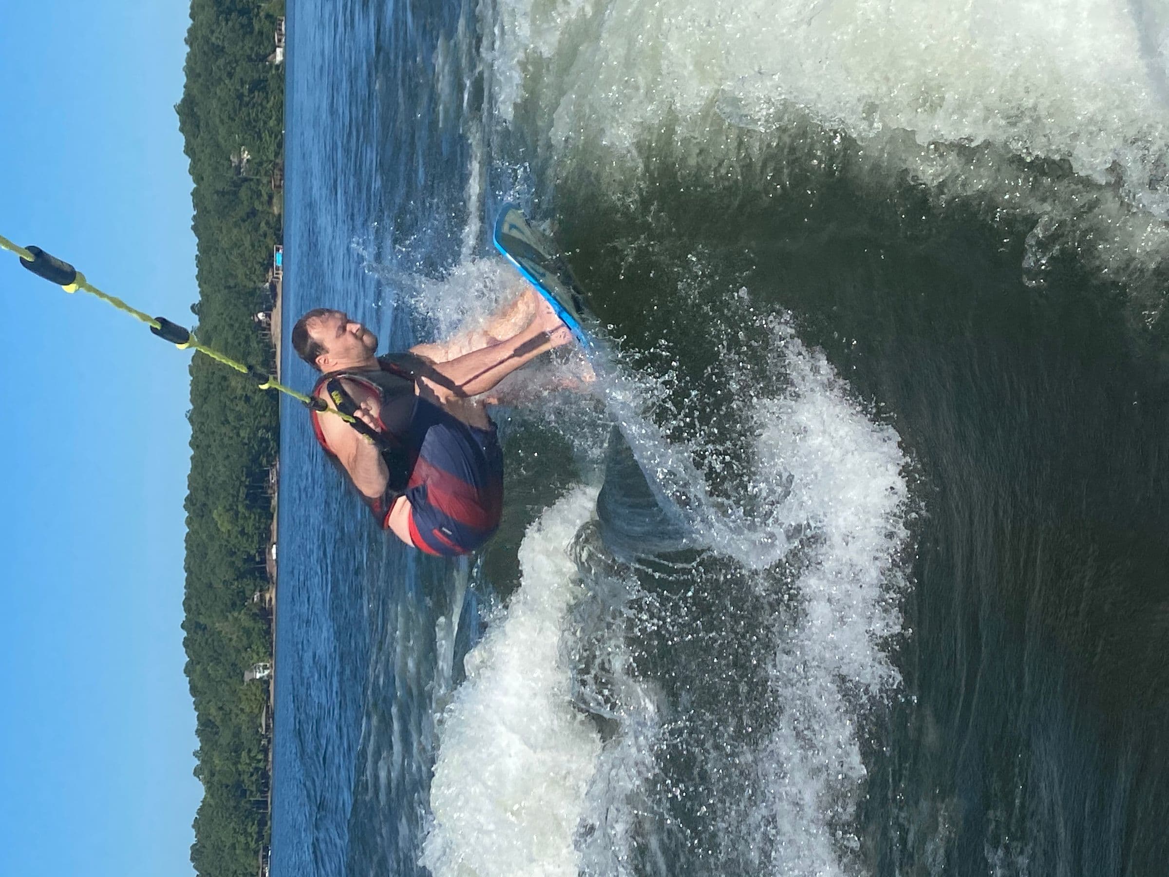 Wake surfer hitting a wake high