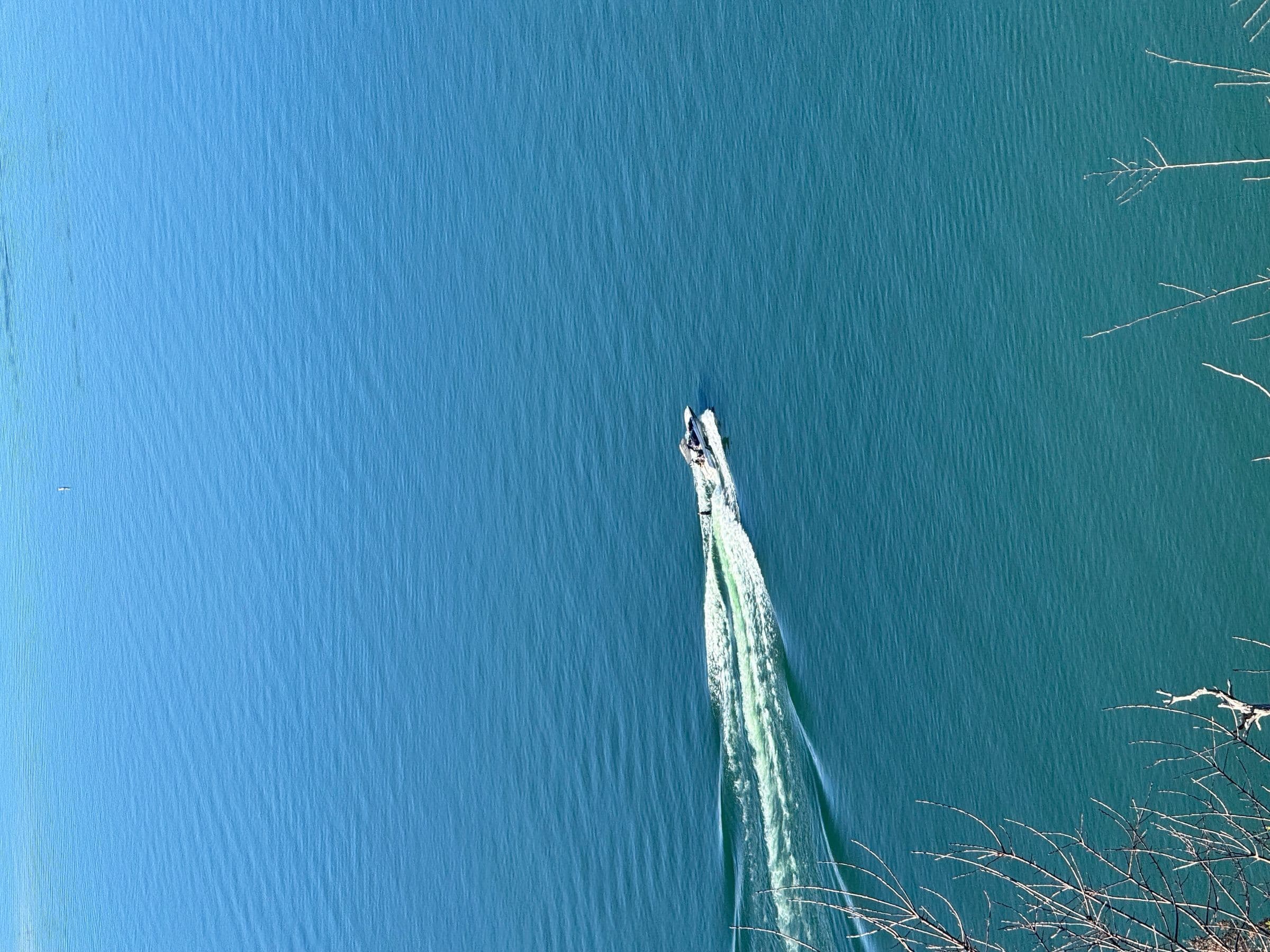 Aerial view of a surfer on Lake Austin