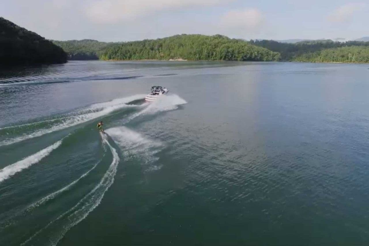 Norris Lake Drone Aerial View with Pontoon in the distance