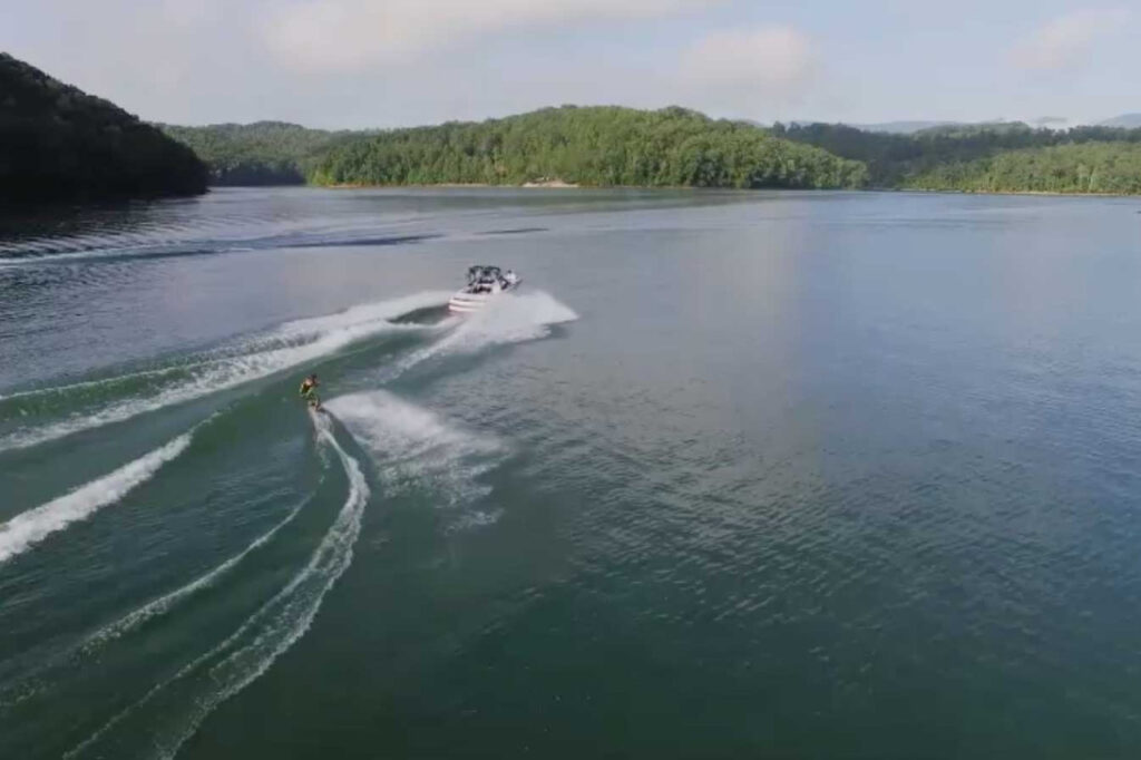 Norris Lake Drone Aerial View with Pontoon in the distance